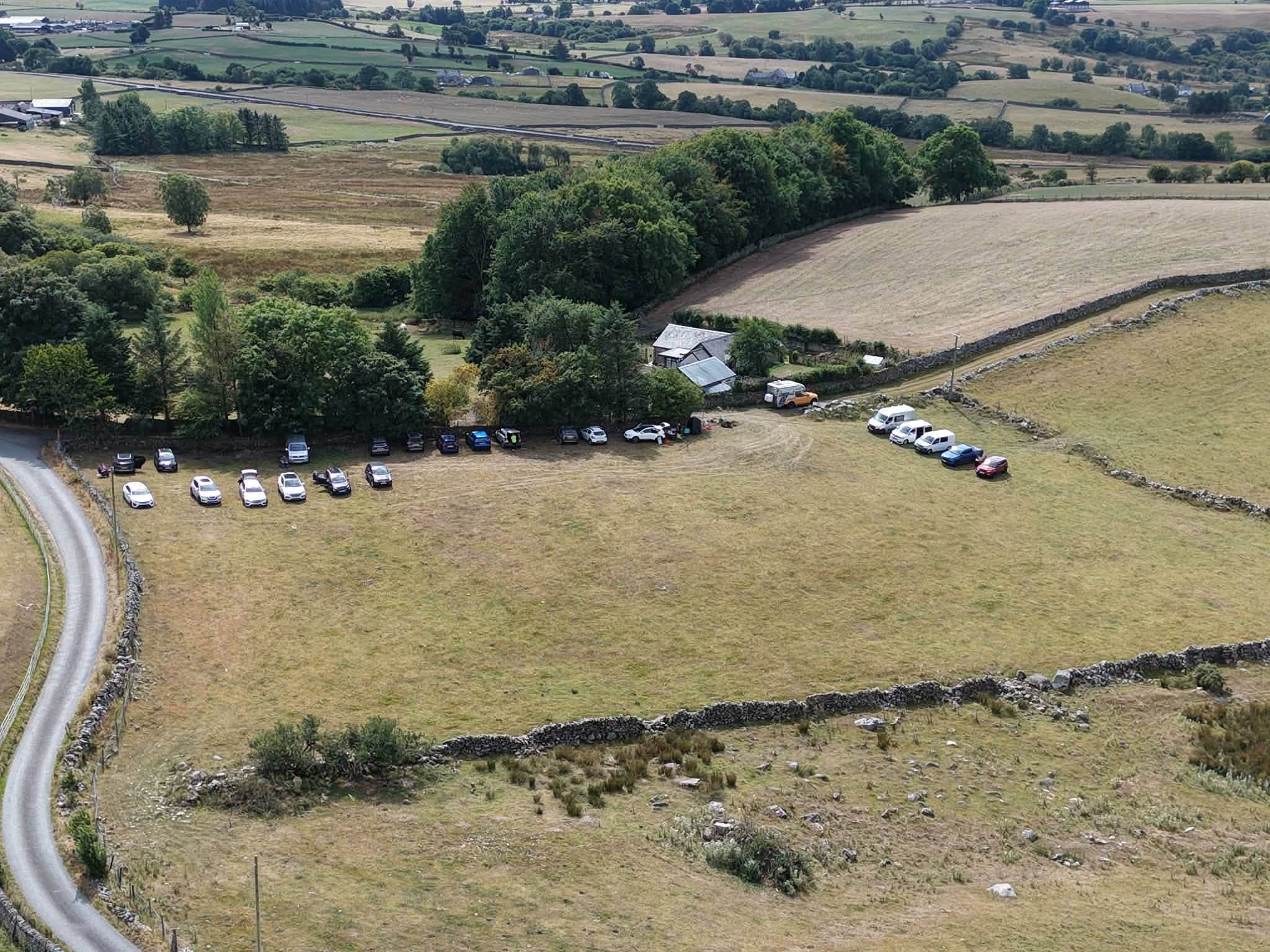 Aerial view of detectorists and vehicles at a group dig